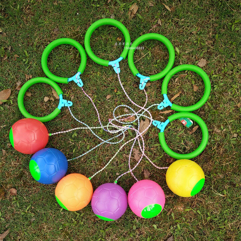 Jumping ball child flashing around adult spinning single foot ball child throwing football