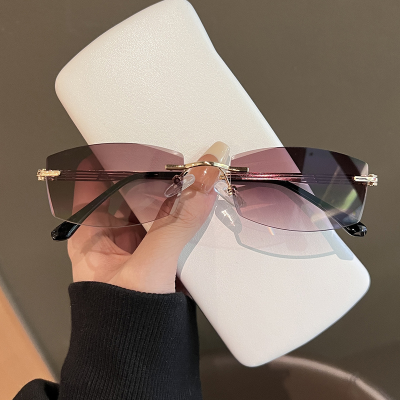 Retro Ultra-Light Personalized Rimless Sunglasses for Women 2024 New Summer Travel Small Face Anti-Uv Sunglasses Trend