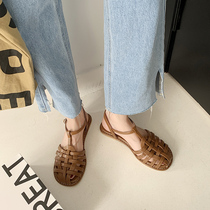 Baotou sandal women Summer flat-bottomed 2021 new vintresses Gentle Fairy Wind Hollowed-out Weaving 100 Hitch Flat Roman Shoe