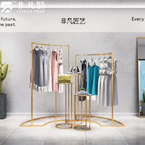 Golden clothing store display rack floor-to-floor arc middle island side hanger running water table combination display rack creative window