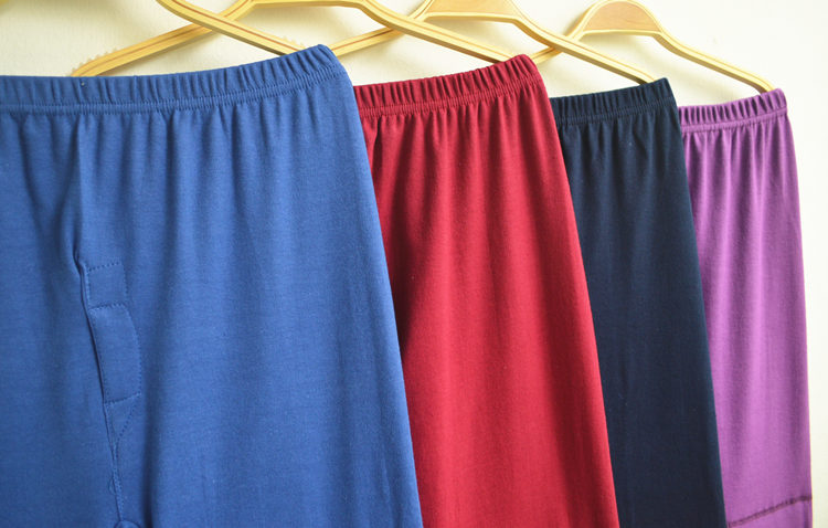 Mùa xuân và mùa thu nam và nữ trung niên quần mùa thu với đầu gối quần legging dài cotton dày màu tinh khiết cao eo lớn quần dài ấm áp quần áo giữ nhiệt nữ