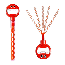 Holding a five-claw 32-hole bubble wand with a smiley face open a large number of times to blow bubbles children’s outdoor toy 2077