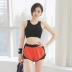 Quần short thể thao rộng rãi chống trống của phụ nữ mặc ngoài quần tập thể dục kích thước lớn lót quần yoga quần chạy nhanh khô thoáng khí mùa hè - Quần thể thao