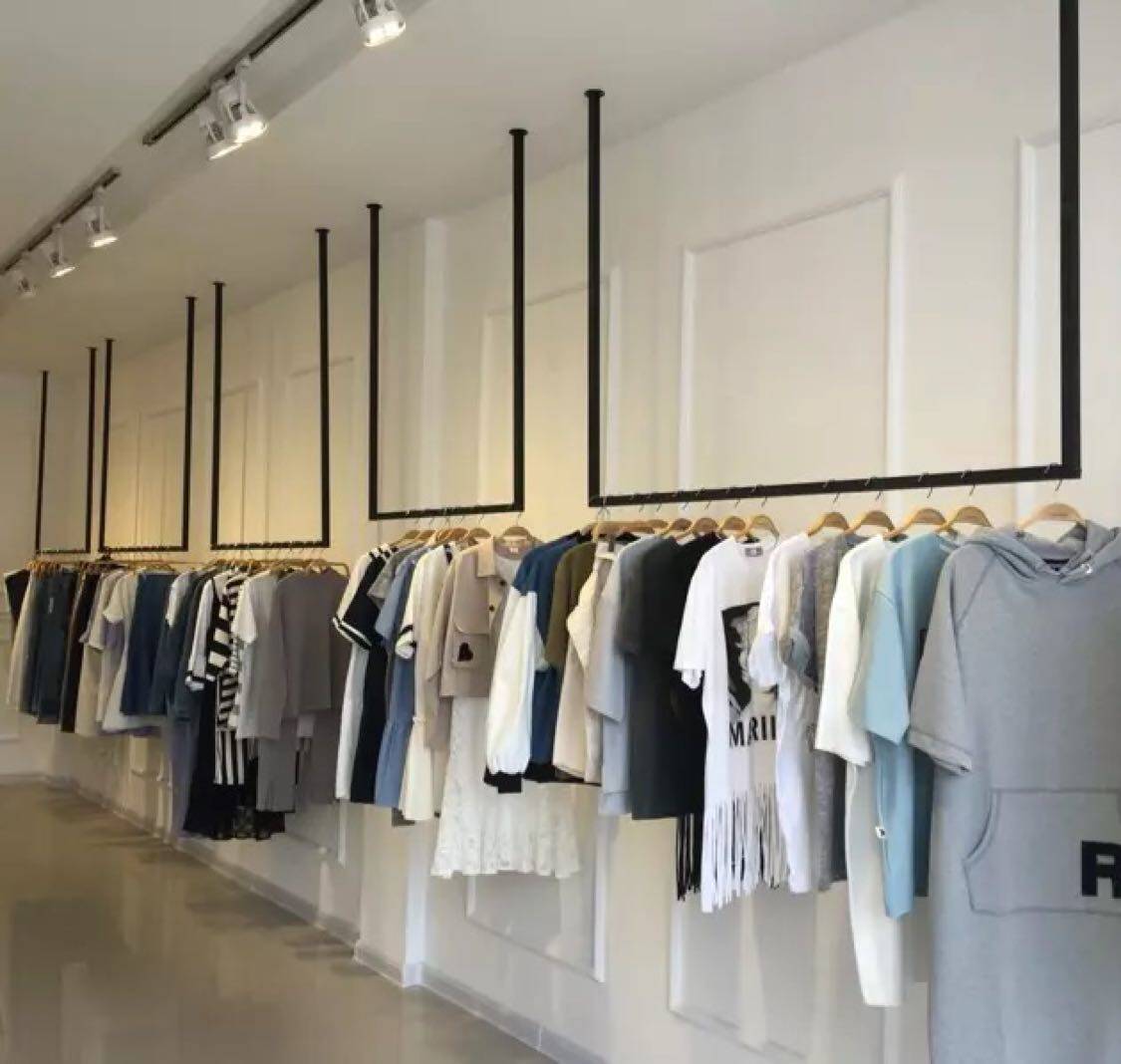 Iron clothing shop rooftop hanging clothing display hanging ceiling ceiling men and women wearing clothes shelves on wall dress rack