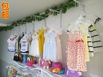 Wrought iron clothing store on the wall hanging clothing display rack Shoe bag display rack is hanging hangers Childrens clothing shelves