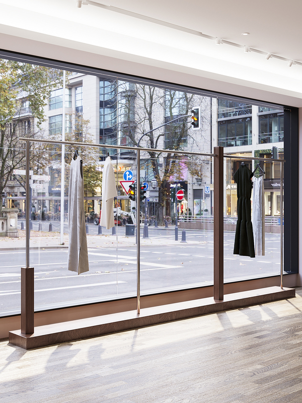 Walnut-Colored Clothing Store Displays Men's and Women's Clothing with Stainless Steel Floor-Standing Clothing Racks and Island-Style Display Shelves Walnut-Colored Clothing Store Displays Men's and Women's Clothing with Stainless Steel Floor-Standing Clothing Racks and Island-Style Display Shelves