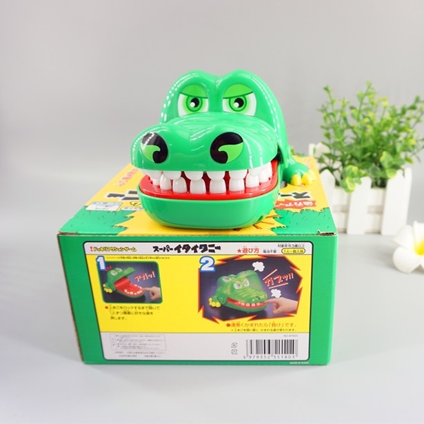 Shivering according to teeth biting a person shark toy biting a finger crocodile adult whole person to blame the whole person for a creative birthday present