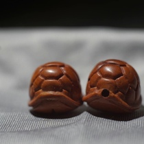 Made of old peach core with dragon pattern it can be used as a cloud-carrying key a toy and a neck-hanging hand-held accessory.