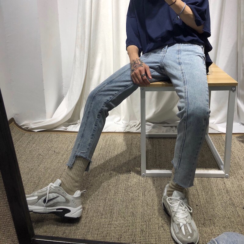 cuibuju 20ss Four Seasons Han version irregular cut splicing 90% pants male wool edging body jeans