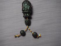 A set of hand-carved ebony head tee pendants