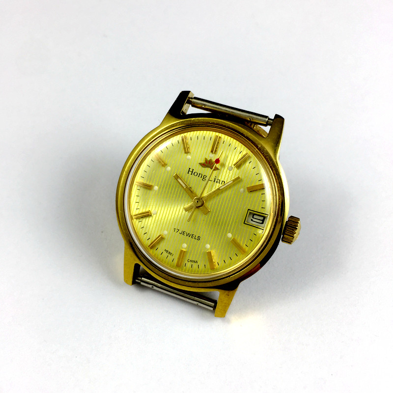 Original stock Shijiazhuang Watch Factory Red Lotus brand single calendar yellow shell yellow face diameter 33 mm to send strap