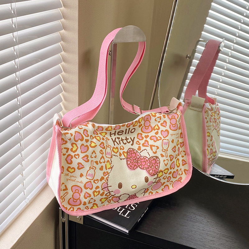Spring and Summer New Niche Girly Heart-Shaped Kt Cat Saddle Bag, Large Capacity Fashionable Crossbody Dumpling Bag, Single Shoulder Canvas Bag