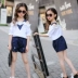 Cô gái phù hợp với một bên vai hè trẻ em Hàn Quốc quây hoa quây tay áo ngắn tay hai dây bé