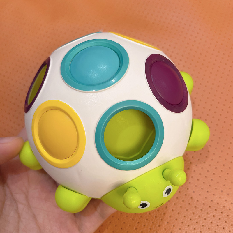 Newborn colorful little beetle hole button baby fingers grasp press coordination of the baby's early teaching toys