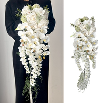 Water drop waterfall holding flowers white Phalaenopsis calla lily bouquet bride wedding simulation flower wedding wedding photography
