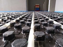 Standardized floor heating construction uses a paved floor heating module