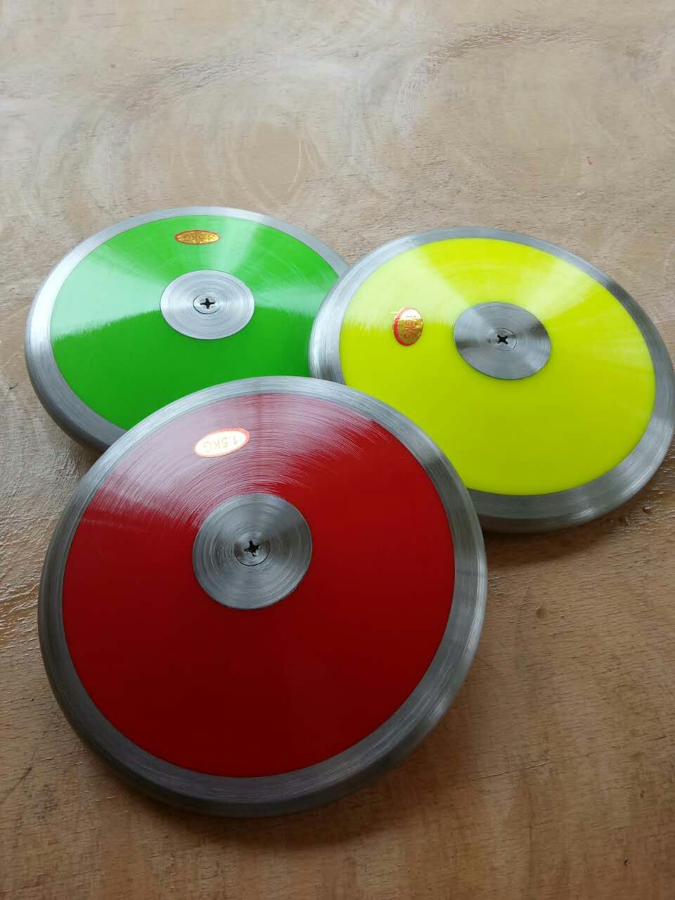 Trò chơi trường học Theo dõi và lĩnh vực cạnh tranh Discus Thiết bị thể thao Bánh gỗ rắn Bánh Nylon 1kg2kg Tiêu chuẩn Discus cây tập xà đơn