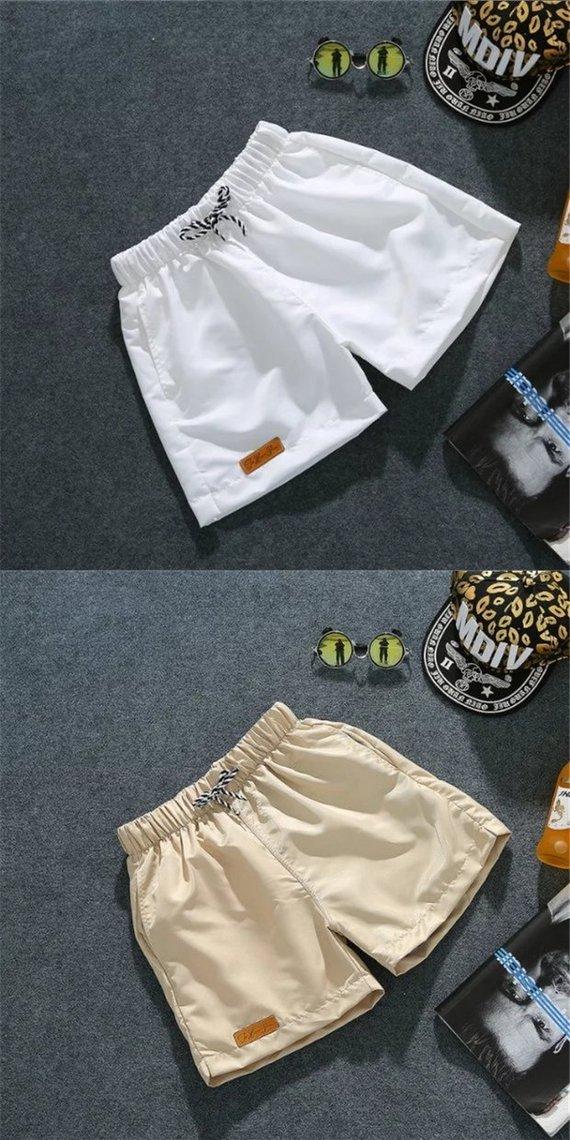 Quần short nam mùa hè chạy ba quần rộng quần lớn tinh thần xã hội quần bãi biển cặp vợ chồng ngủ nhà áo khoác nam
