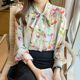 Long-sleeved chiffon floral bow tie French texture temperament shirt female design sense niche early autumn small Hong Kong taste