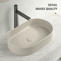 High-end milk tea gray art above-ground basin oval wash basin countertop wash basin ceramic basin basin high-end apartment