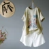 Mùa hè mới cotton và vải lanh in áo thun ngắn tay nữ buông thả cổ tròn ngắn phía trước dài phía sau lưng áo sơ mi mỏng hàng đầu - Áo phông Áo phông