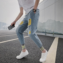 Net Red Tide brand social people hole nine-point denim pants men Korean version of the trend slim feet casual all-purpose