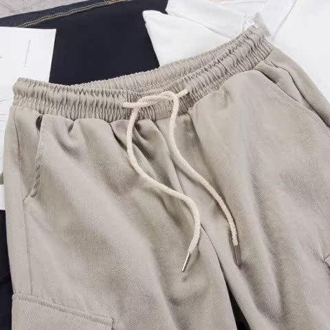 Hồng Kông gió hè mới năm quần xu hướng Nhật Bản dụng cụ quần short thủy triều hoang dã quần rộng bãi biển quần âu thời trang nam