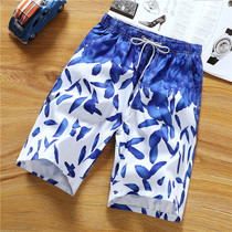 Beach pants mens seaside holiday loose couple five-point flower pants trend in pants youth shorts big pants