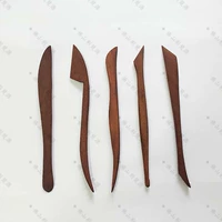 Костюм из красного дерева B.