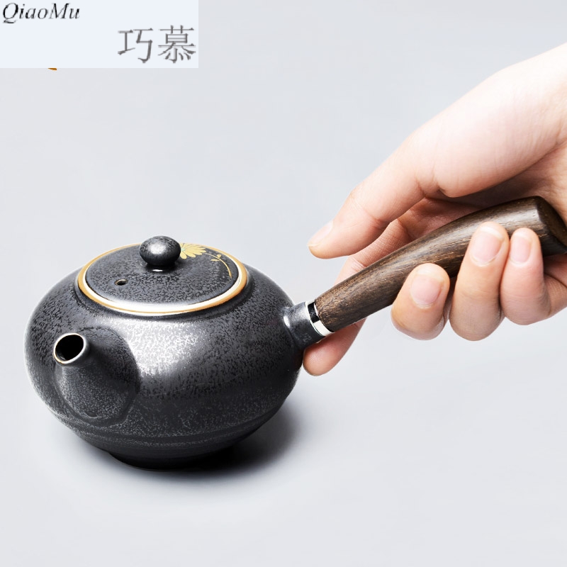 Qiao mu ancient tea exchanger with the ceramics glaze the teapot with wooden handle, side put the pot of kung fu tea set with parts by hand