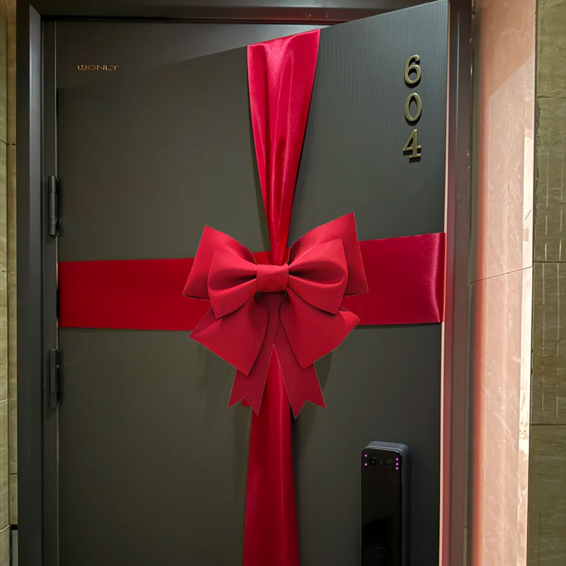 Christmas Large Bow Hanging Decoration on the Door Creates a Festive and Ceremonial Atmosphere for Housewarming Scene Setup