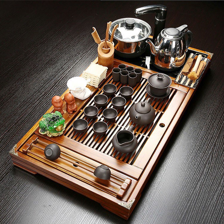 The hutch of a complete set of solid wood tea tray package ceramic kung fu tea tea set household contracted with integrated electric magnetic mixture furnace