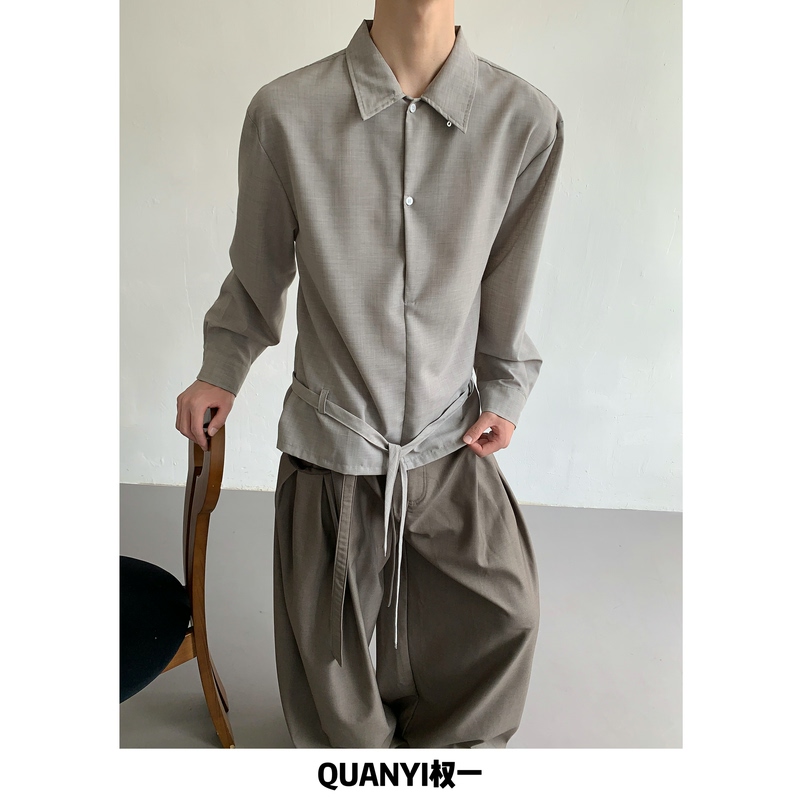 Quan Yi, a High-End Designer, Has Created a Unique Lace-Up Long-Sleeve Shirt for Men with a Half-Open Collar, Layered Design, and Tie-Up Silhouette, a Niche Item