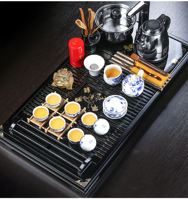 Kung fu tea set automatic water induction cooker four unity kembat drainage solid wood tea tray was purple sand cup suit household