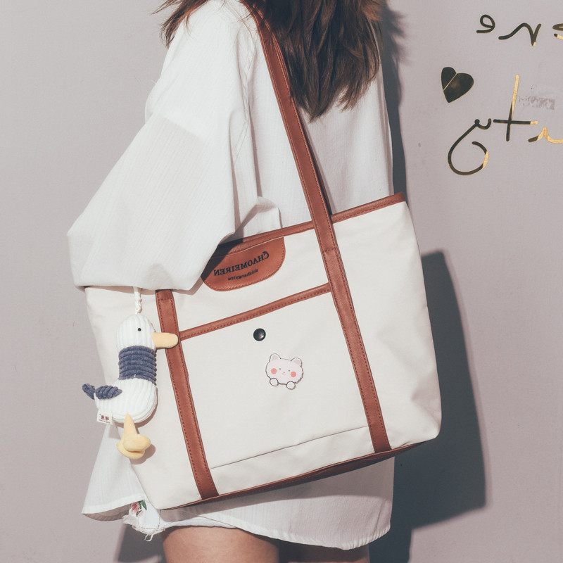 Hong Kong large-capacity one-shoulder canvas bag female 2021 new tote bag retro wild college student class bag