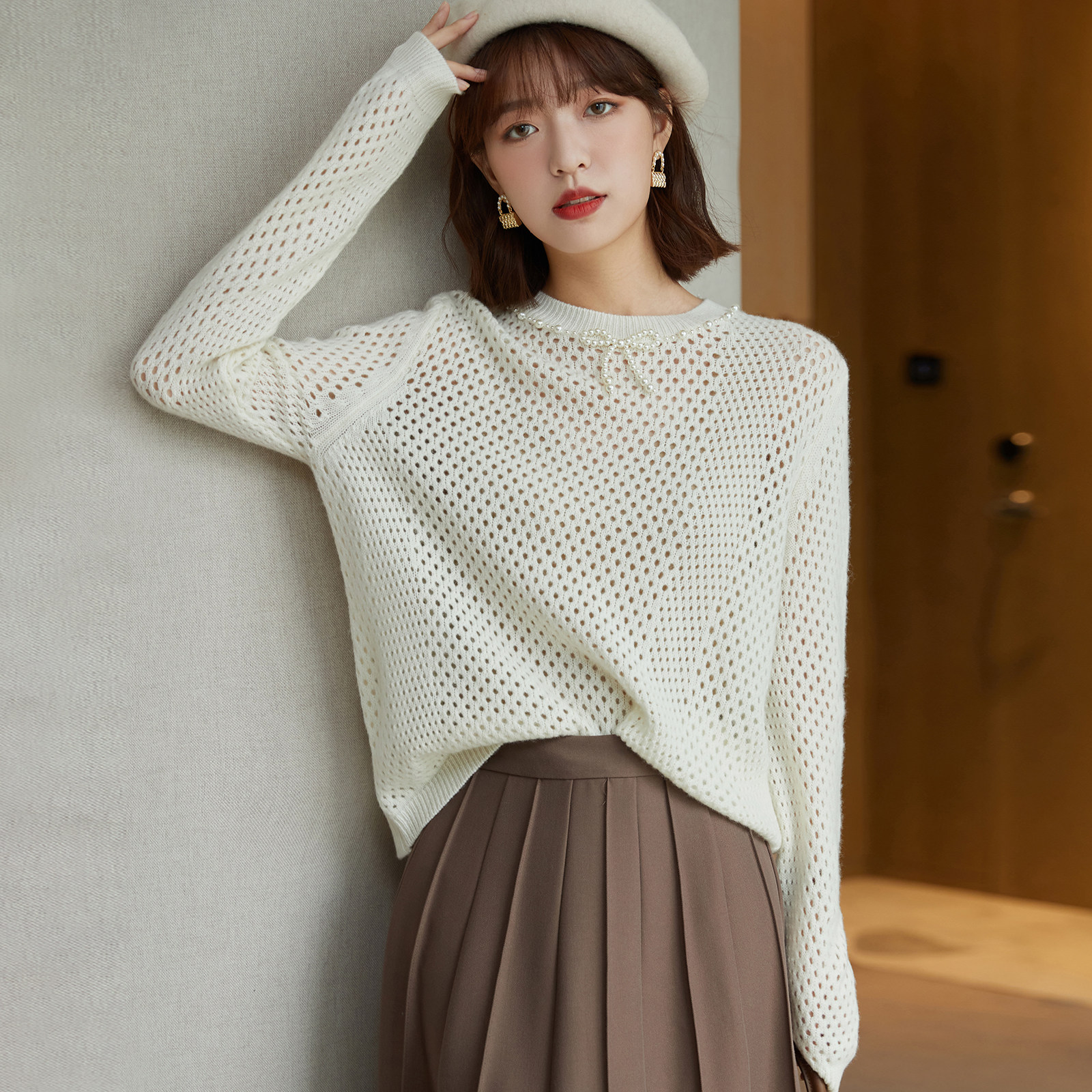 The French style design sensation niche hollowed-out wool knit cardigan 2022 spring autumn new temperament slim 100 lap sweaters women