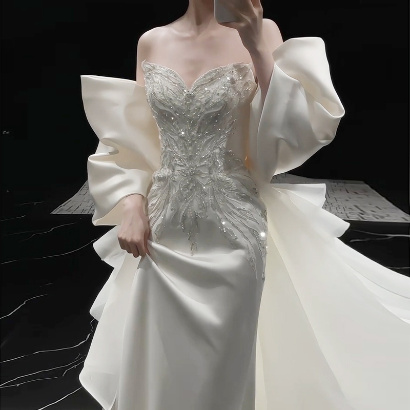 New Satin Fishtail Wedding Dress with Off-The-Shoulder Design, Large Bow, and Trailing Train for Light Outings, Suitable for Engagement and Light Luxury Occasions New Satin Fishtail Wedding Dress with Off-The-Shoulder Design, Large Bow, and Trailing Train for Light Outings, Suitable for Engagement and Light Luxury Occasions