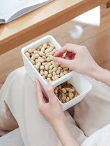 Lazy people chase drama to eat melon seeds dried fruit plate with mobile phone bracket double melon seeds plate to eat desktop garbage can home