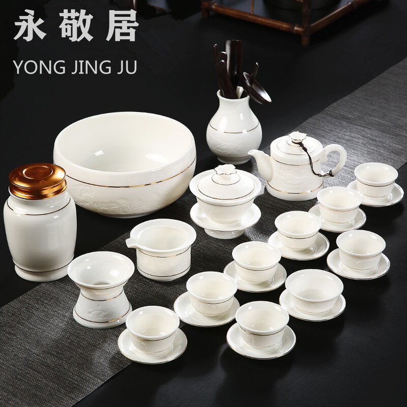 Sheep fat jade white porcelain net red kung fu tea set complete set of office shadow carving gold teapot cover bowl household ceramics