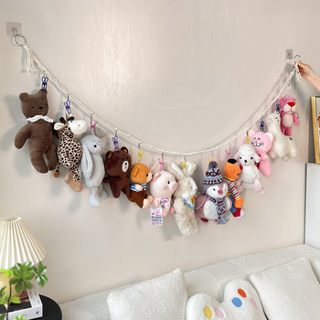 Doll storage artifact display lanyard on wall