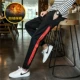 Quần nam phiên bản Hàn Quốc của xu hướng quần hip hop cộng với chân nhung quần thủy triều thương hiệu quần ống rộng thể thao giản dị thu đông quần jean nam