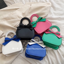 2022 new children and girls bright color contrast color big bow pu leather portable one-shoulder oblique cross parent-child mommy bag