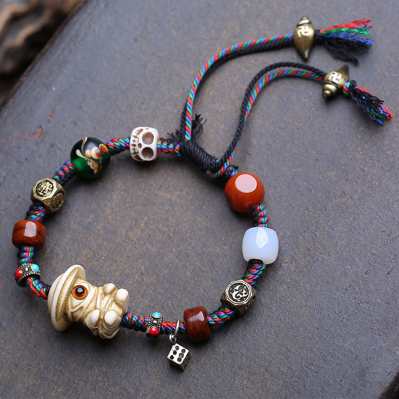 Natural Deer Antler Carving One-Eyed Monster Ornament Handmade Braided Rope Bracelet with Agate, Glass, and Copper Accessories
