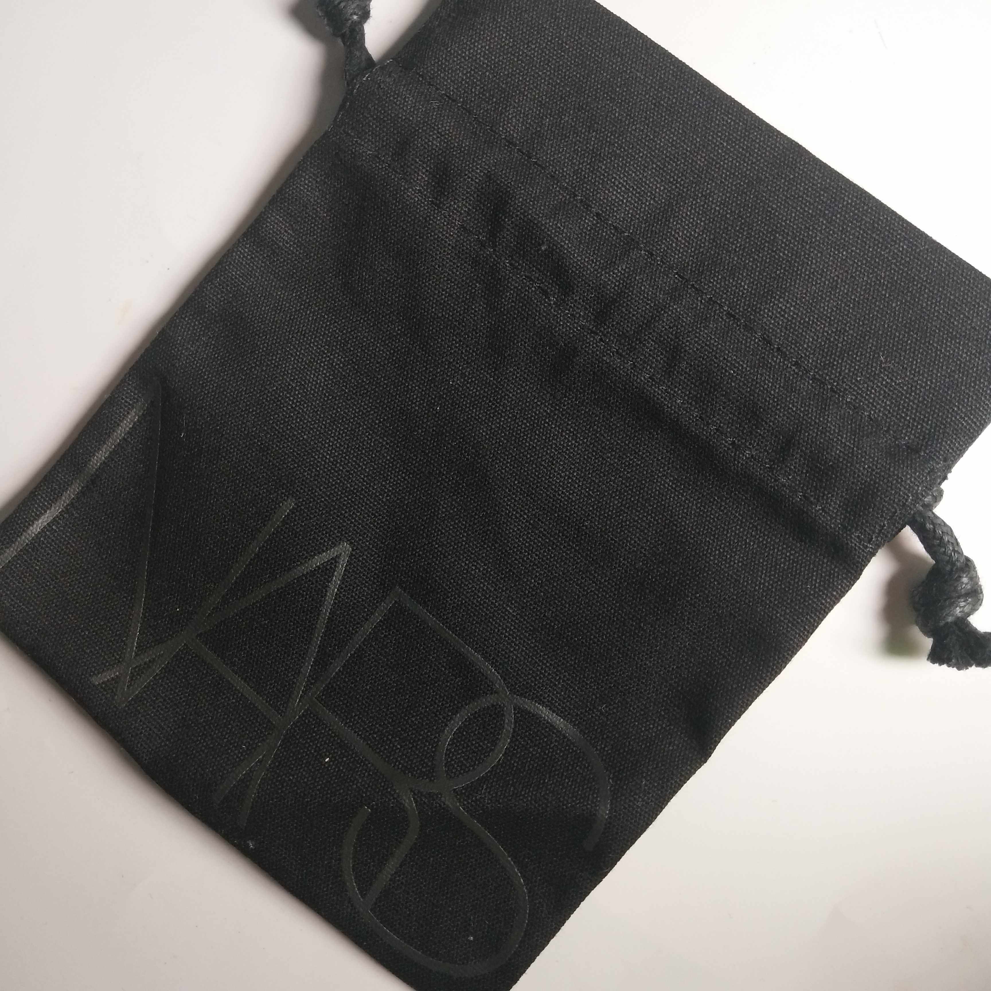 Swap for a single pat on the back of no Nars black portable cashier bag