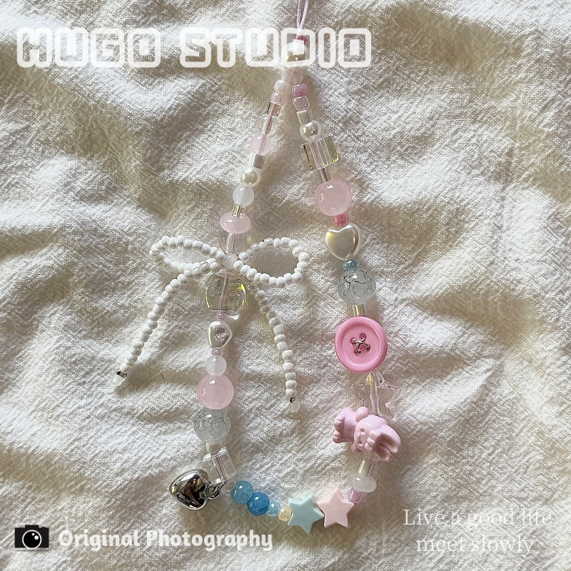 HUGO Instagram-style pink button rabbit beaded phone charm for cameras, bags, and phone cases.