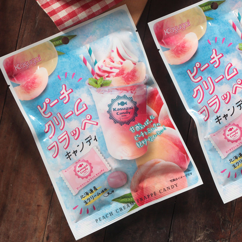 Japanese original imported Kugi spring day well cream caramel white peach ice cream 76g candy bar candy little snacks