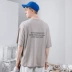 KM Men 2019 Mùa hè Mới Hàn Quốc Loose Half Tops In màu rắn Đường phố Áo thun nam ngắn tay - Áo phông dài