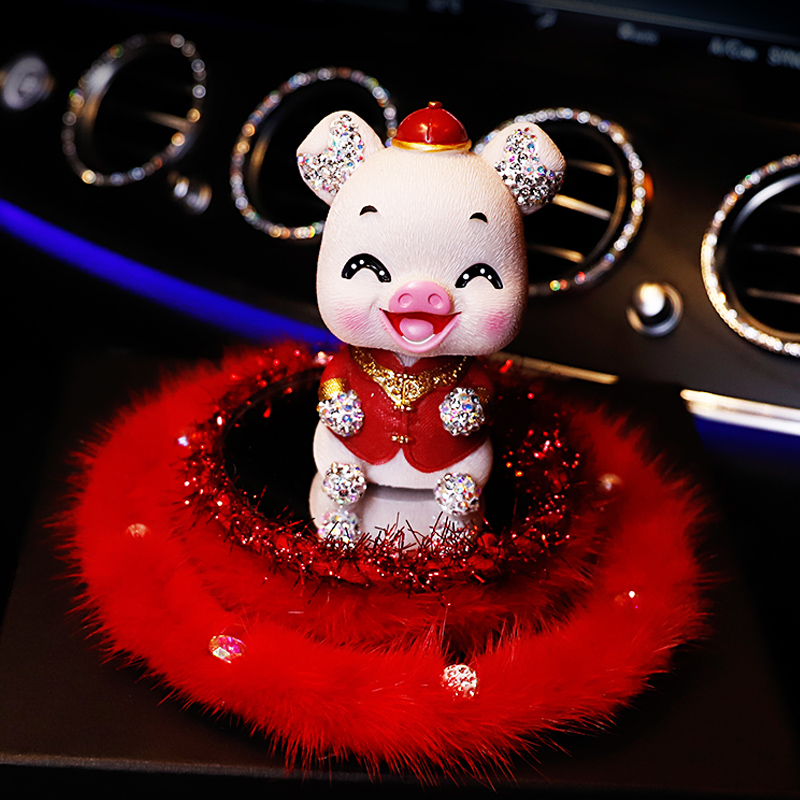 New Year's creative car ornaments cute female personality shaking his head pig car perfume decoration car interior accessories ornaments