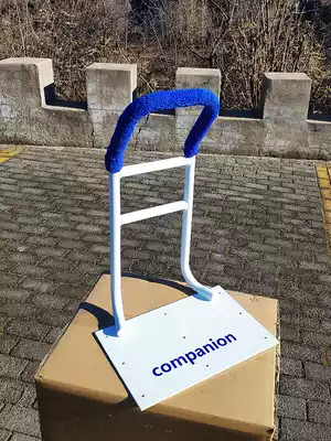 The old man gets up to help the white armrest bedside guardrail to keep warm. The wrench helps the night tool to be fixed and installed.