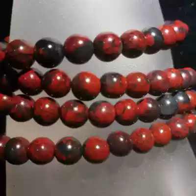 Natural formation of Guilin chicken blood Jade dry Kun material black background red boutique 108 beads particle size 0 7cm men and women
